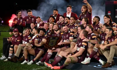Queensland players and staff celebrate their 2025 Origin series win over New South Wales.