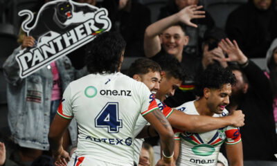 New Zealand Warriors players celebrate against Penrith Panthers.