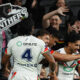 New Zealand Warriors players celebrate against Penrith Panthers.
