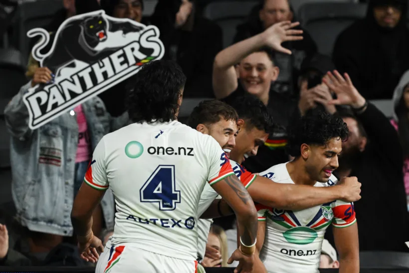 New Zealand Warriors players celebrate against Penrith Panthers.