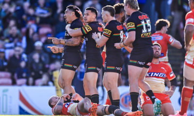 Penrith Panthers' prop Moses Leota scores against the Dolphins.