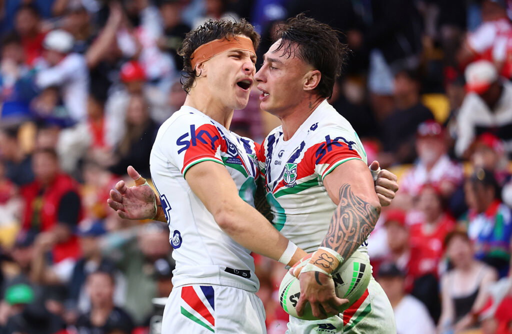 New Zealand Warriors star Charnze Nicoll-Klokstad celebrates his try against the Dolphins with teammate Sam Healey.